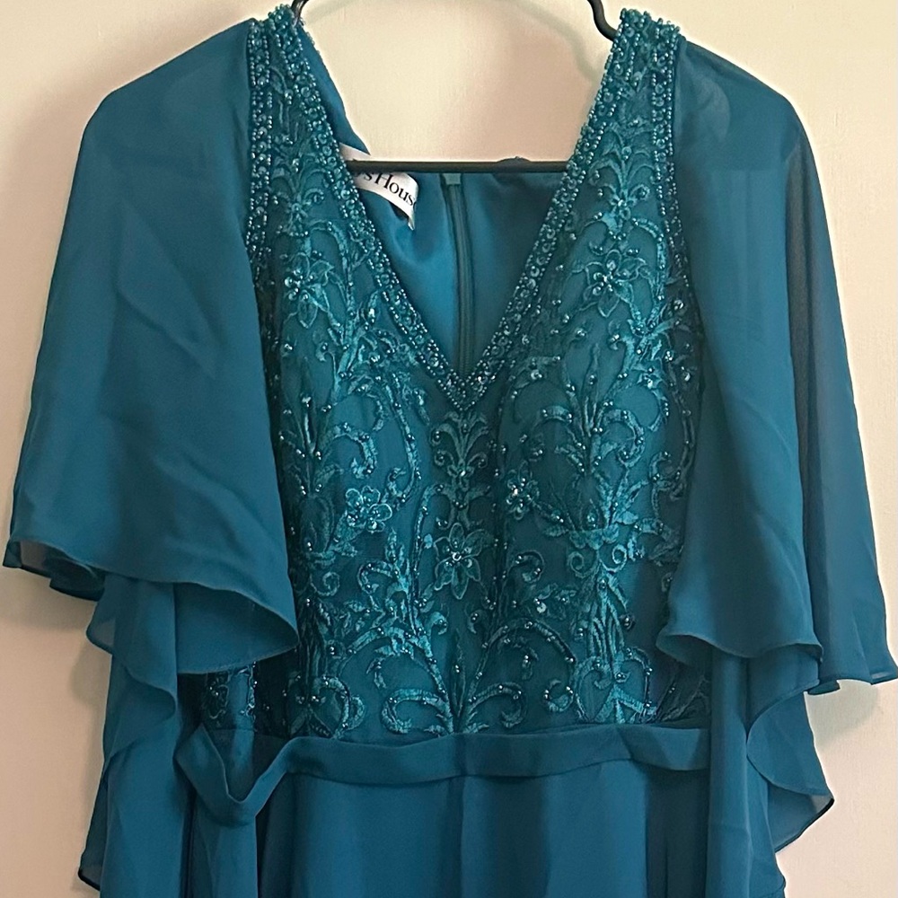 Formal gown. Never worn. Peacock (teal blue green) beaded. Size 14